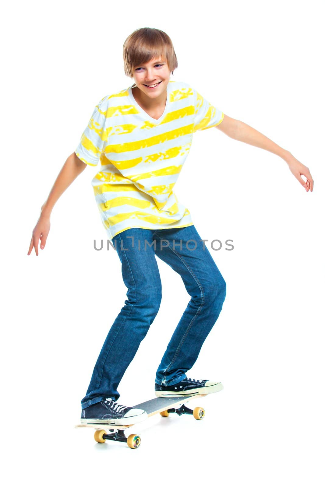 cute teenger blond boy on standing on skateboard isolated on white background