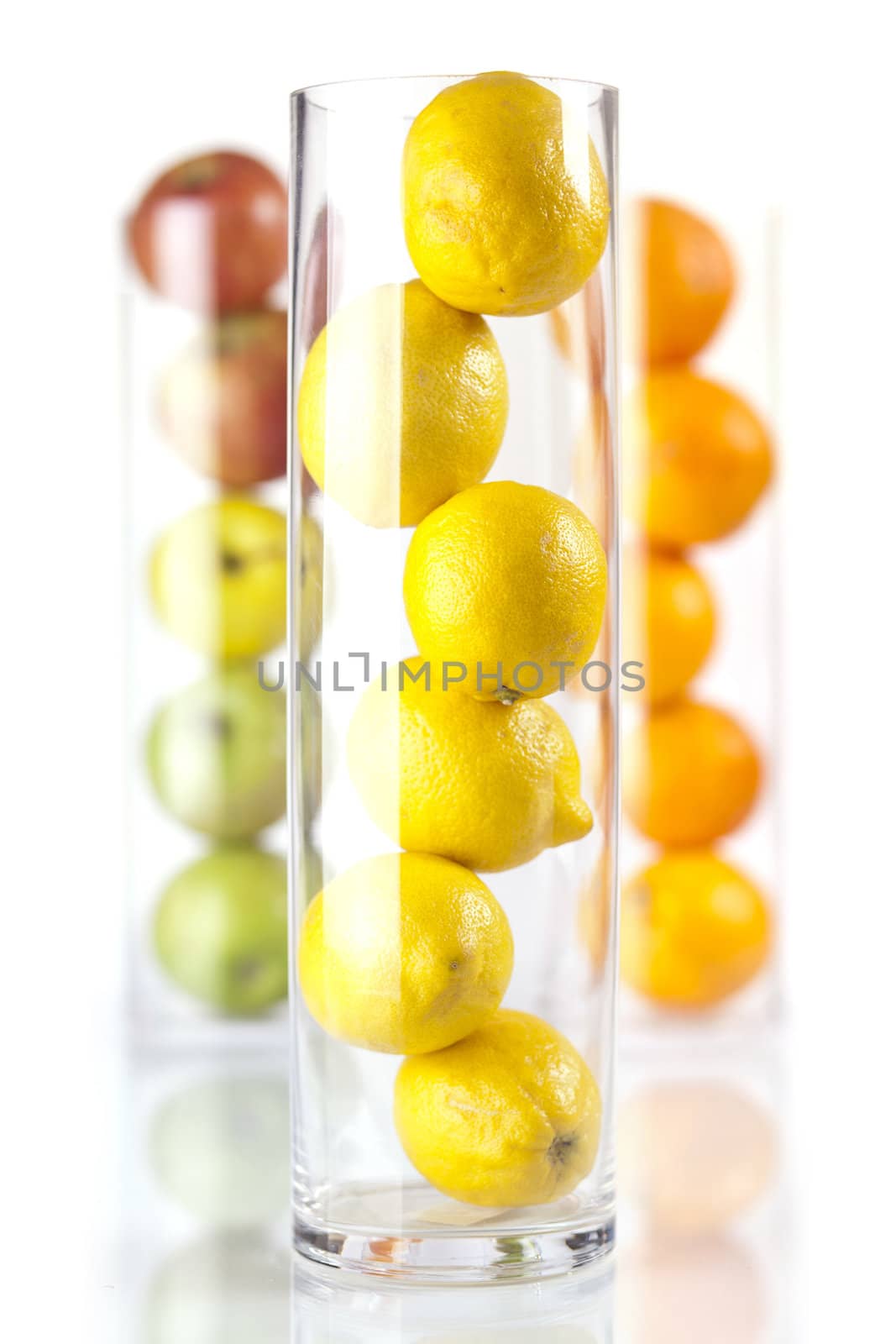 Group of fruit in glass: Lemons, Oranges, Appless