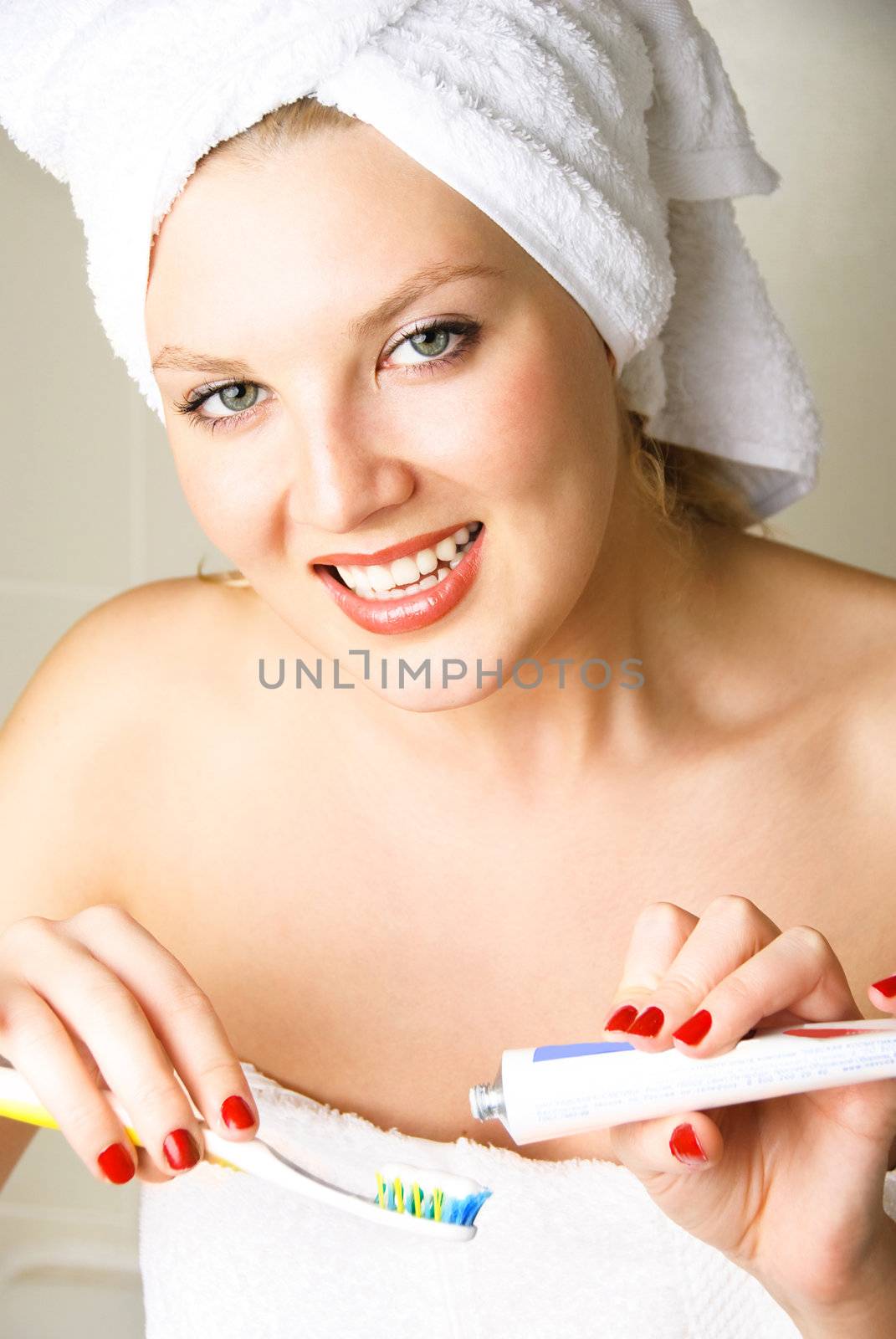 beautiful woman brushing her teeth by lanak
