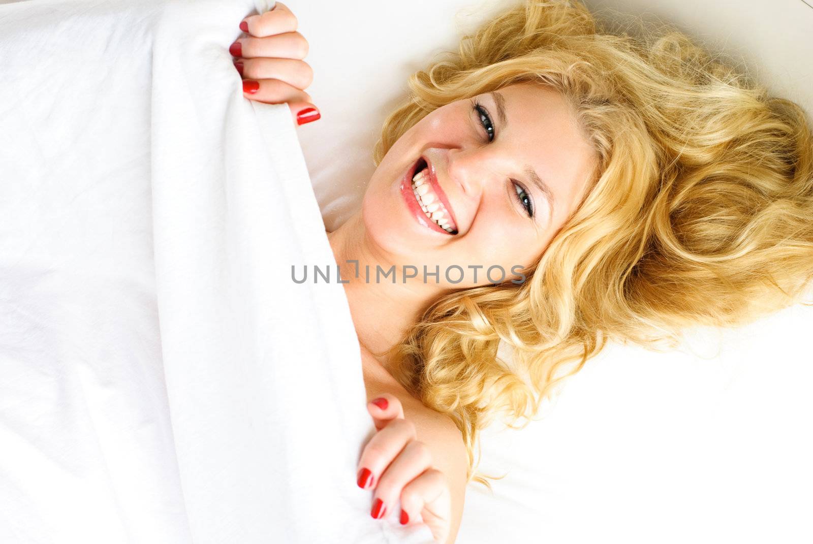 laughing girl in bed by lanak