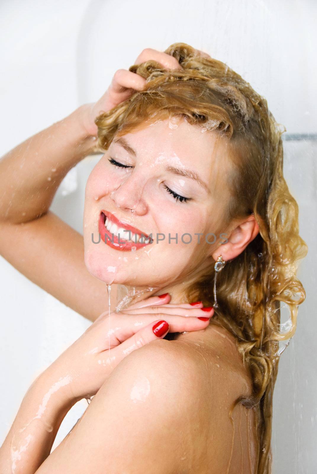 pretty woman washing her hair by lanak