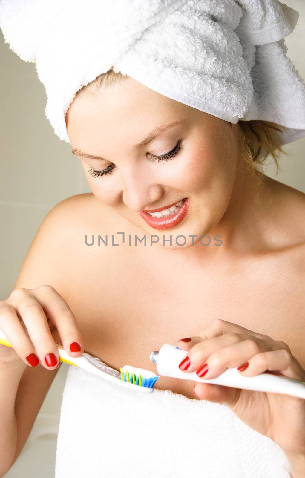 pretty girl brushing teeth by lanak