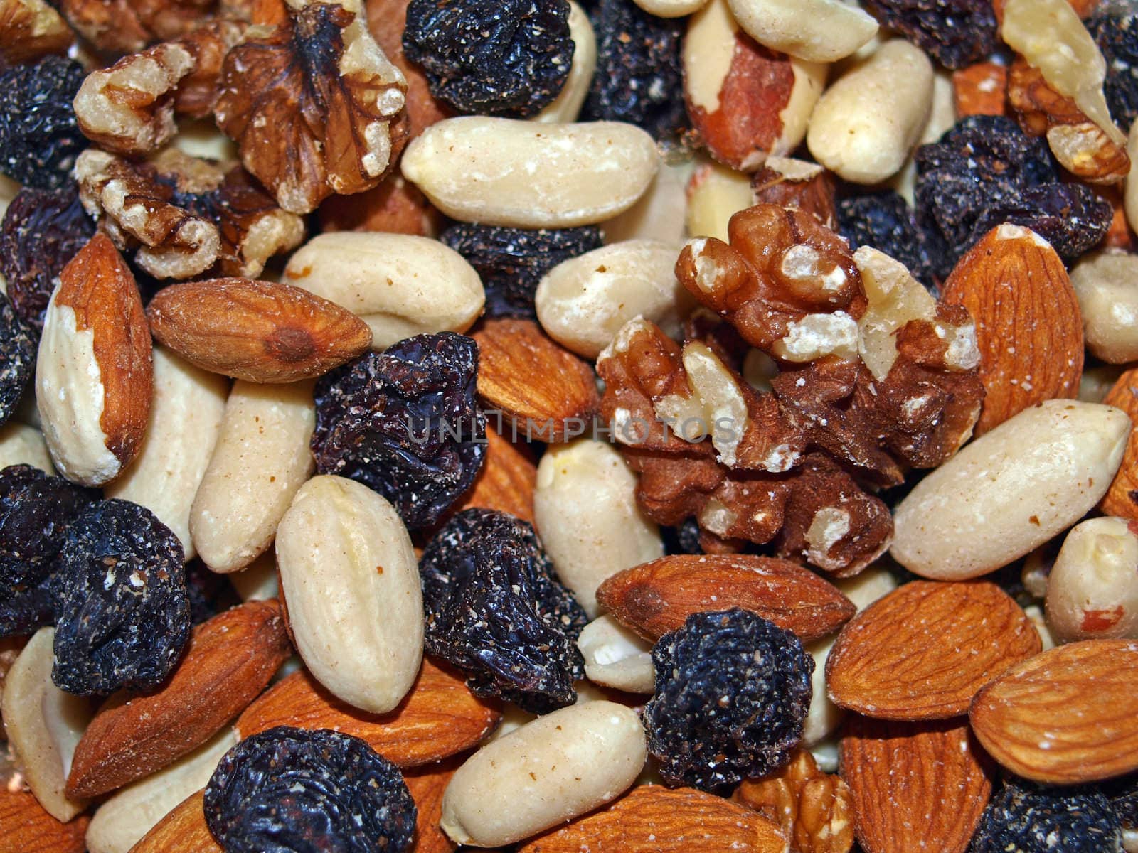 Closeup of healthy mixted fruit and nuts.