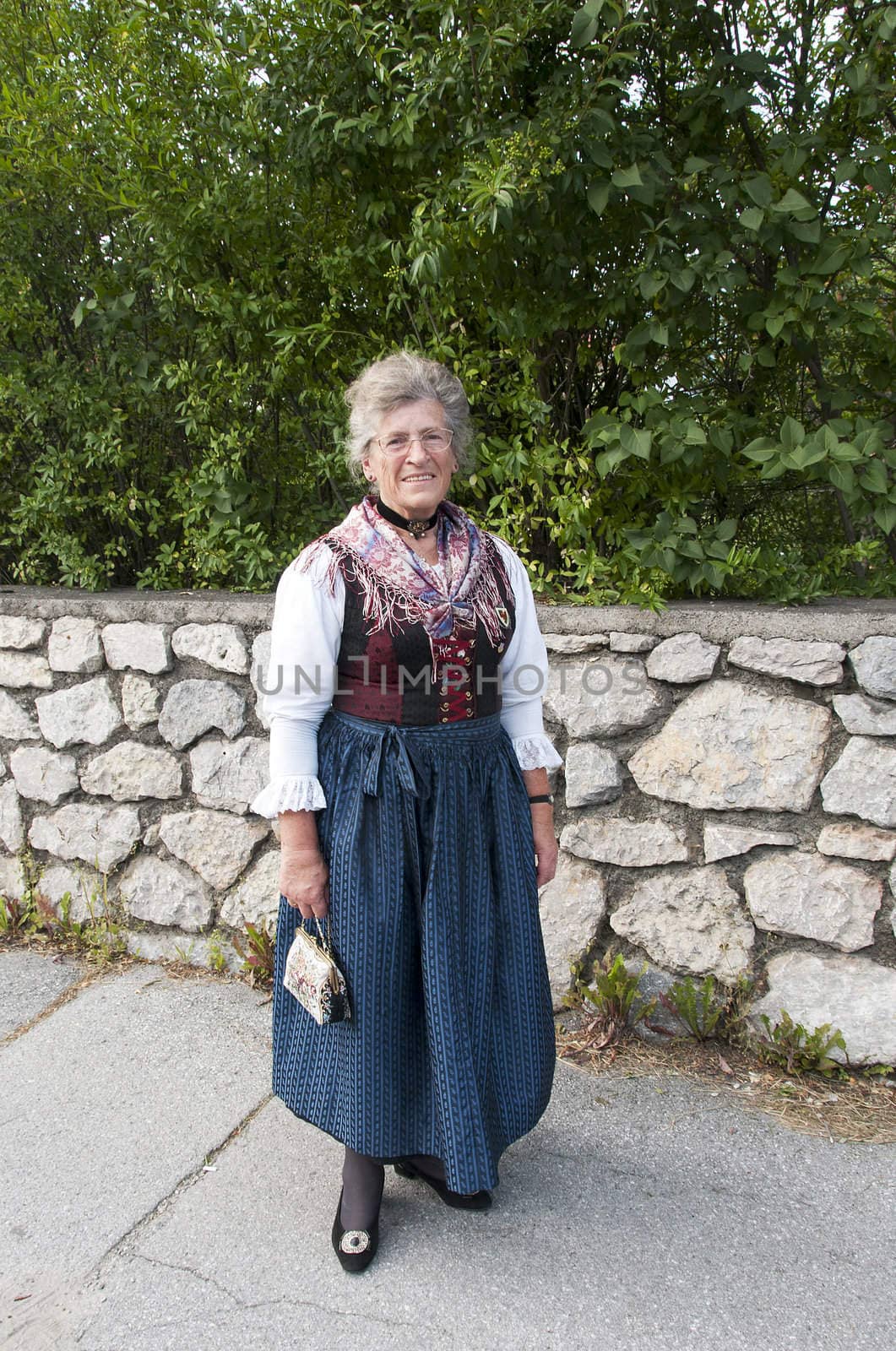 AXAMS,AUSTRIA - AUGUST 15:Unidentified woman showing traditonal dress,on August 15, 2012 in Axams, Austria.This dress is worn only at  Maria Ascension is the annual christian celebration in Axam