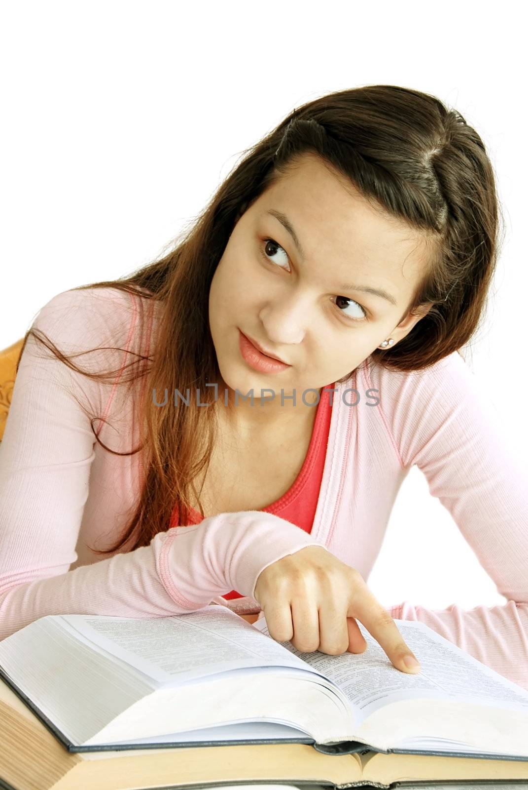 teenage girl portrait with arm on opened book, looking at side