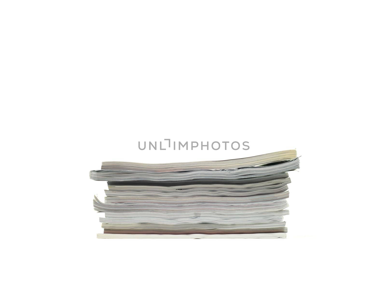 A stack of magazines isolated against a white background