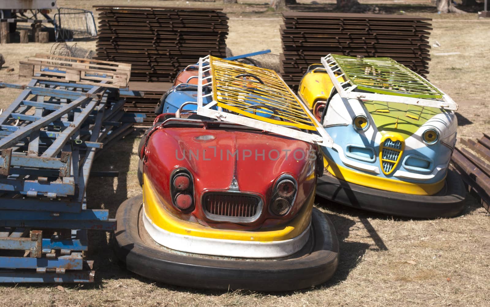cars of amusement park by lauria