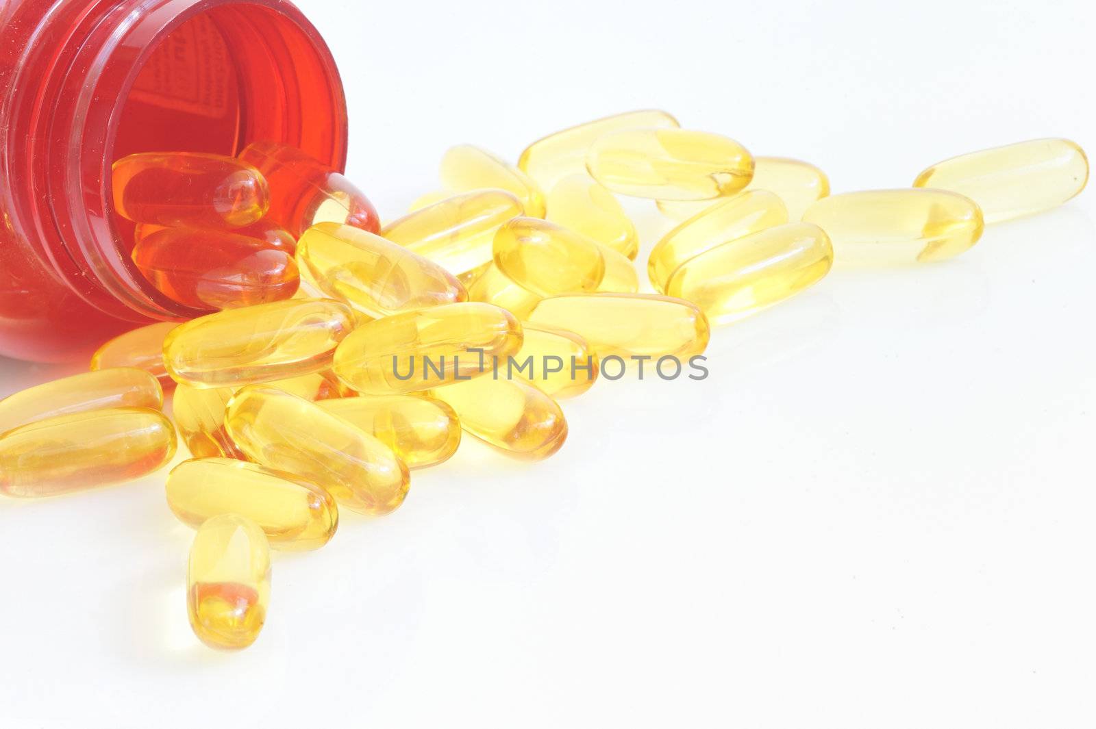 yellow fish oil capsule pile