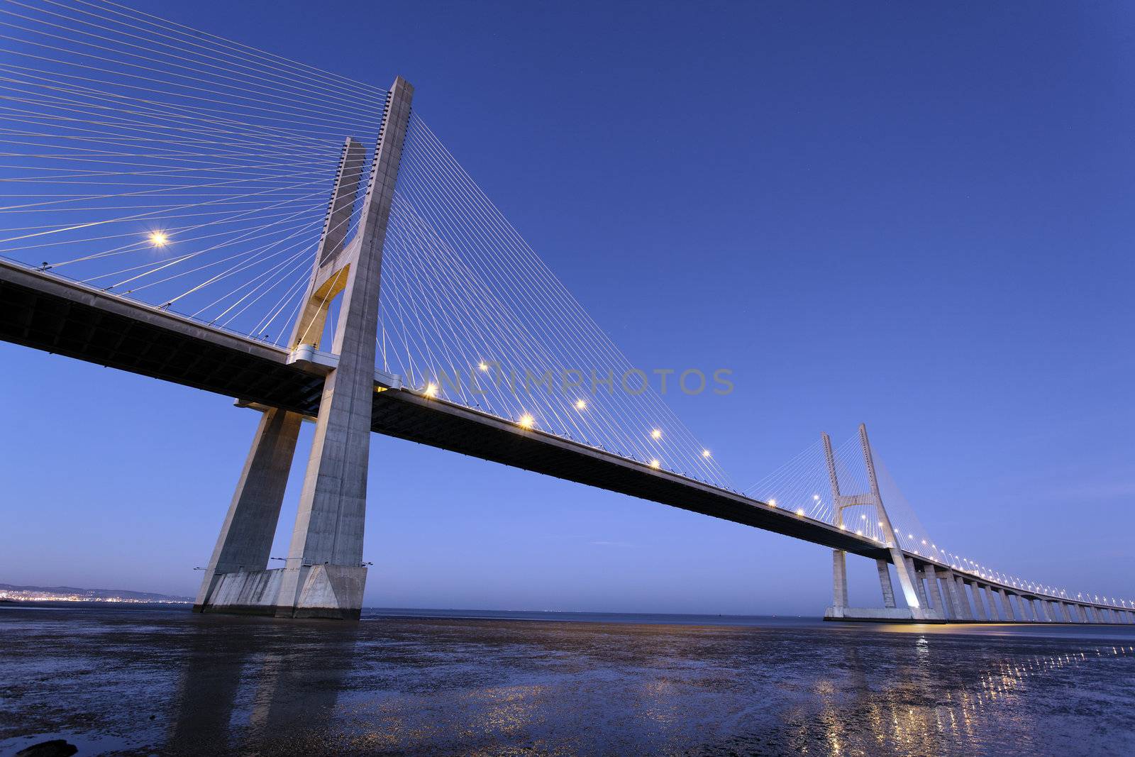 famous Vasco da Gama bridge in Lisbon by night, Portugal 