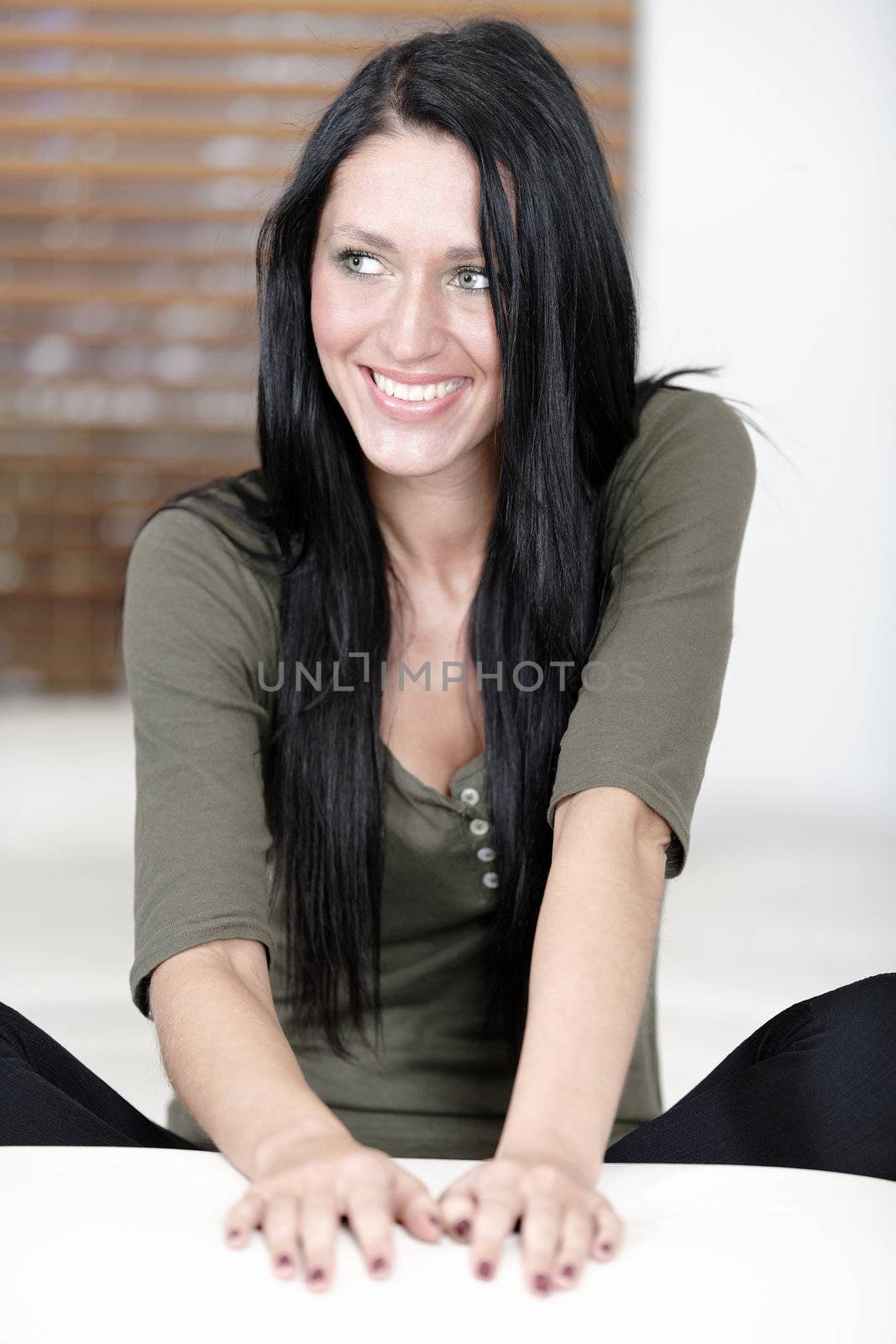 Attractive young woman relaxing on her sofa at home