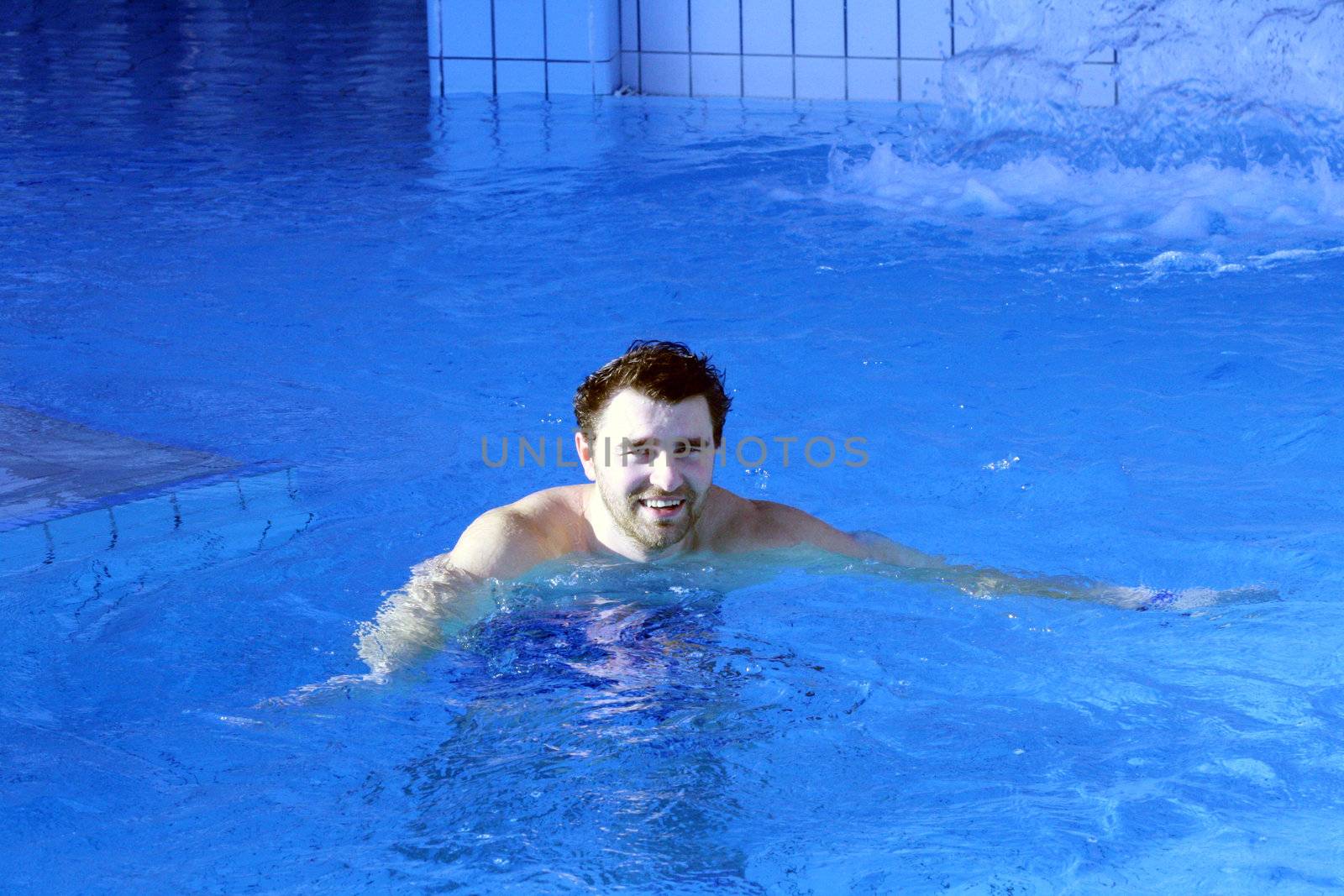 young attractive man relax in spa area