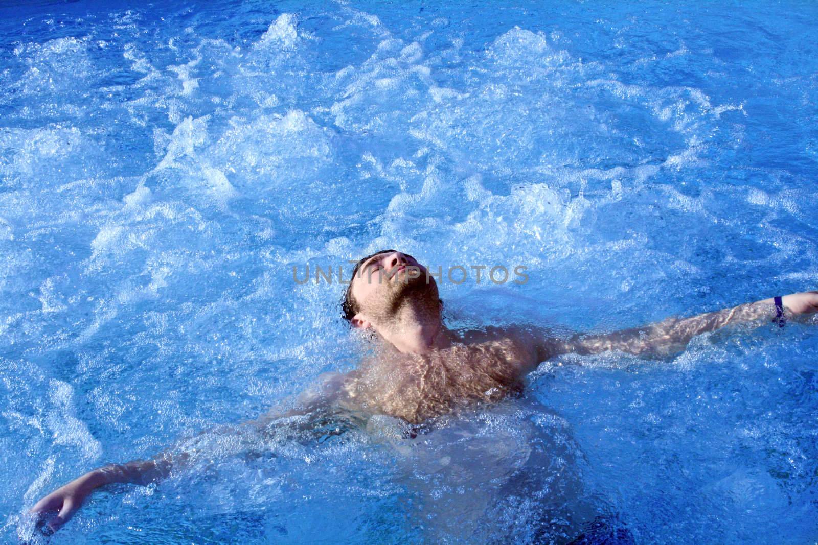 young attractive man relax in spa area