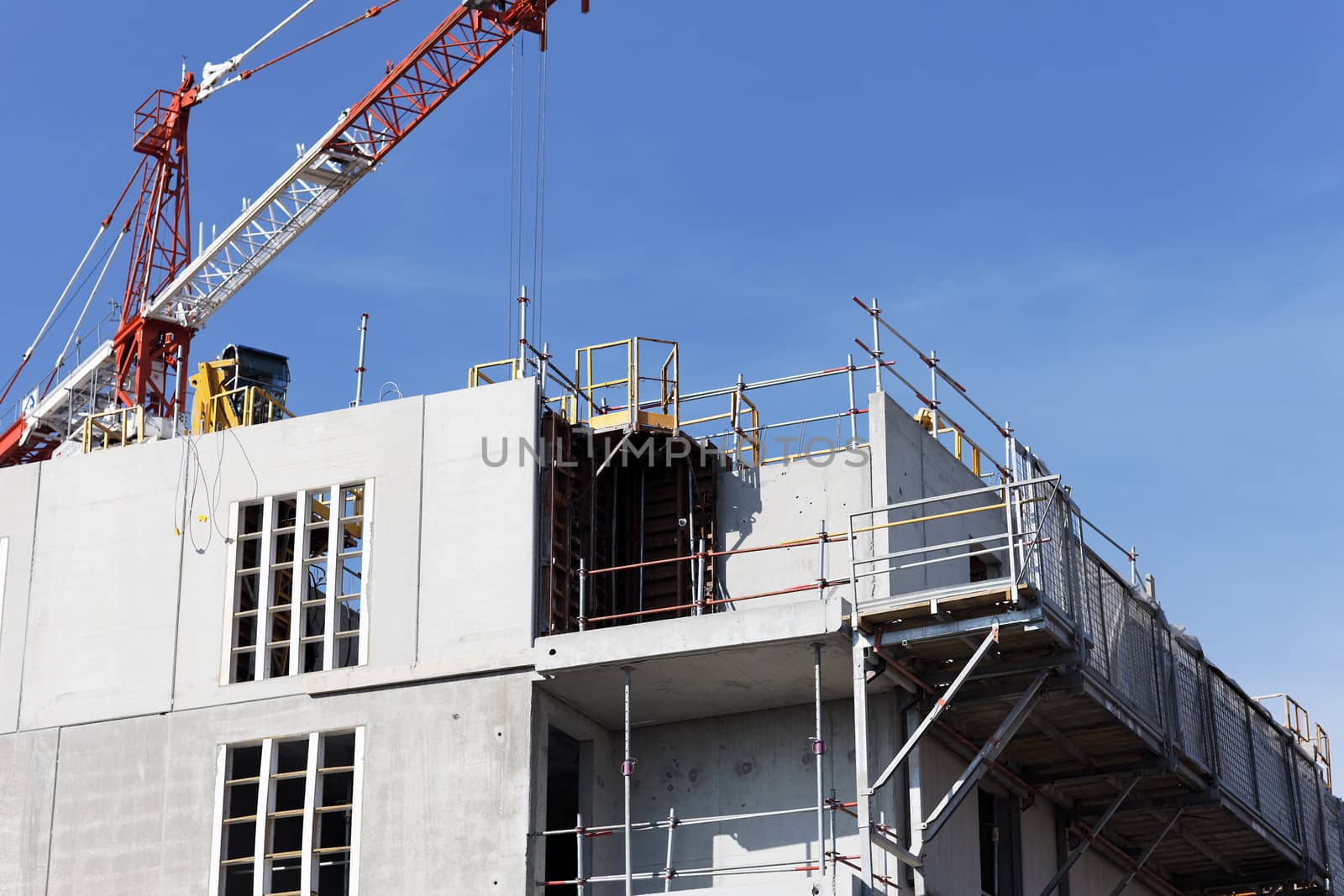 Construction site with crane in blue sky