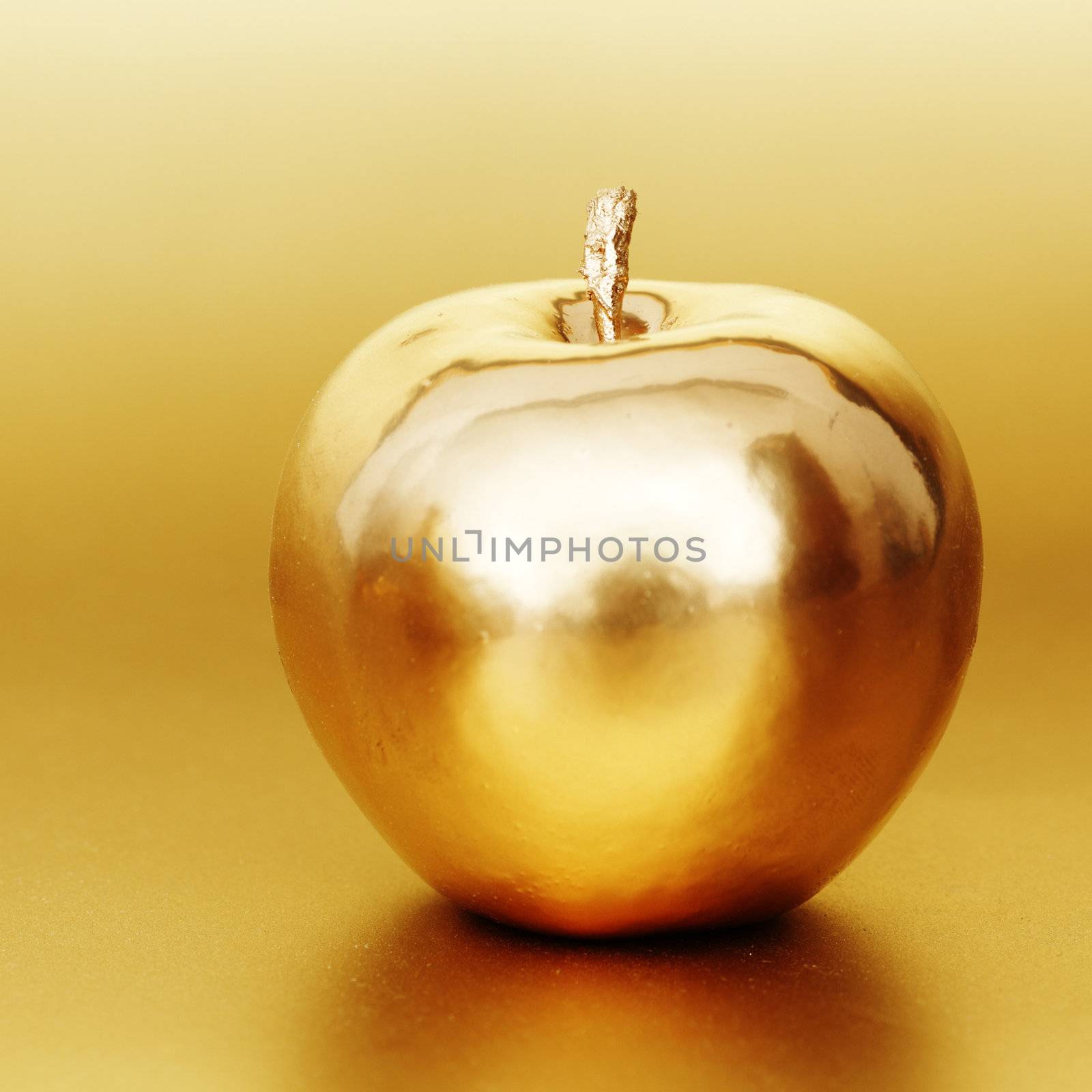  gold apple on gold background