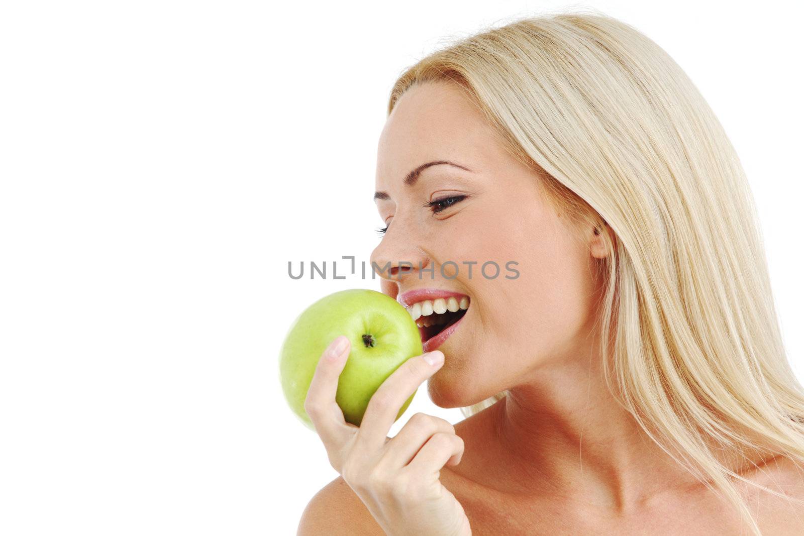 blond woman eat green apple on white