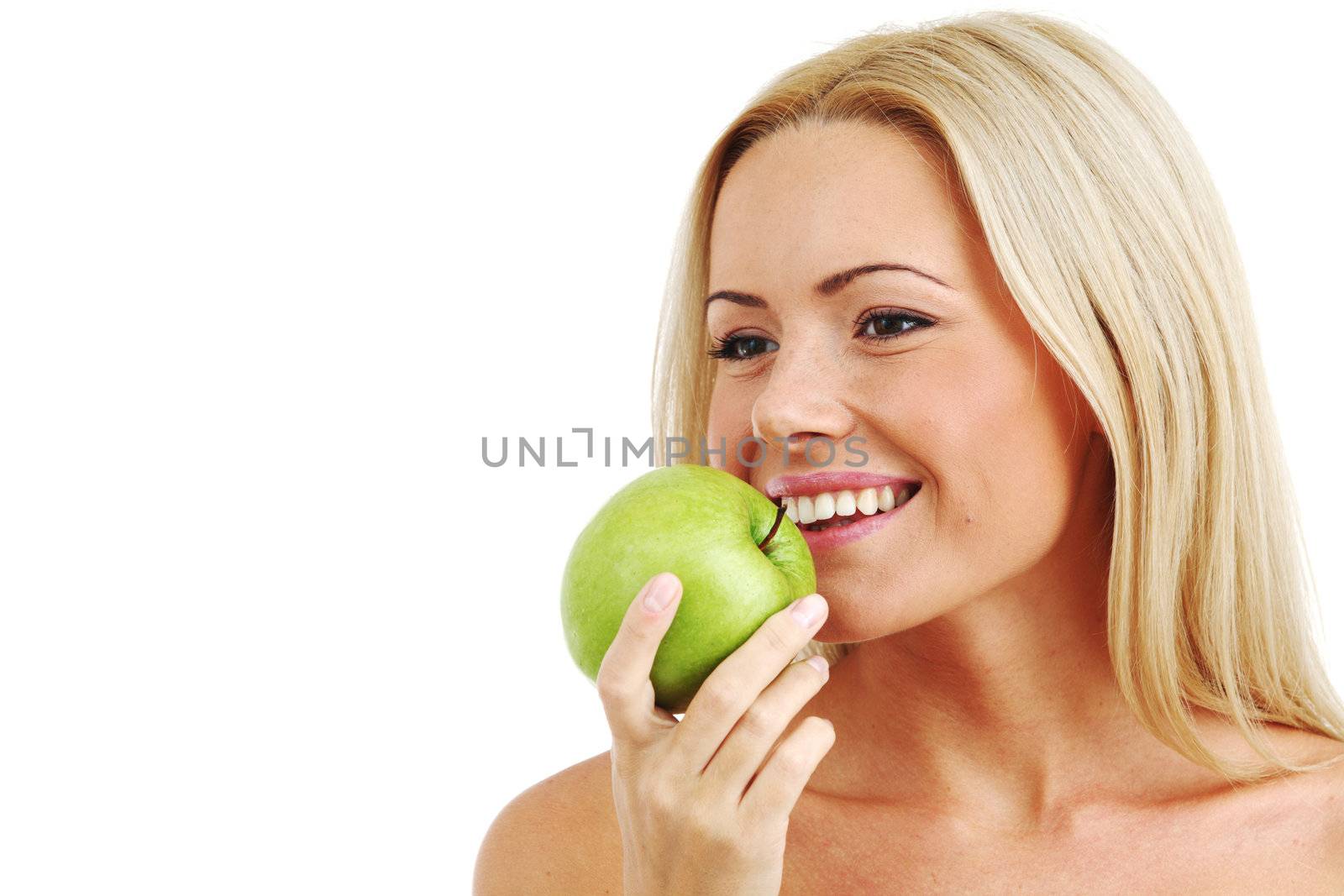 blond woman eat green apple on white
