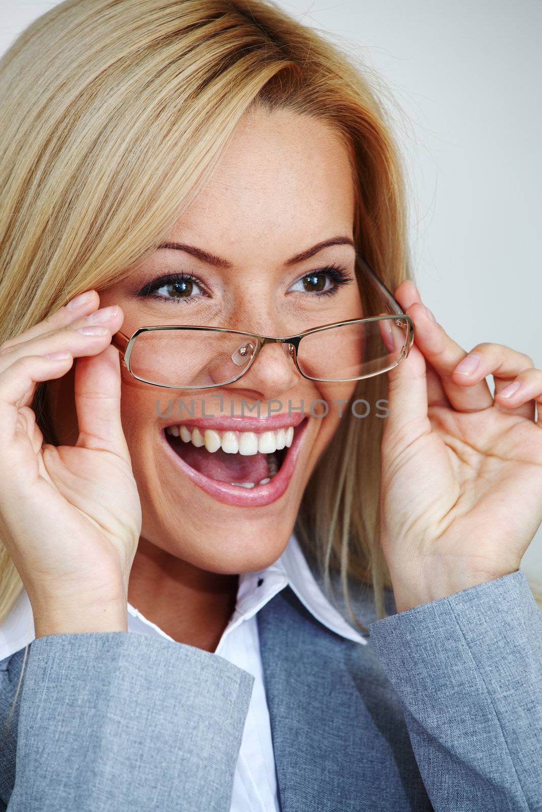 business woman in glasses on gray background