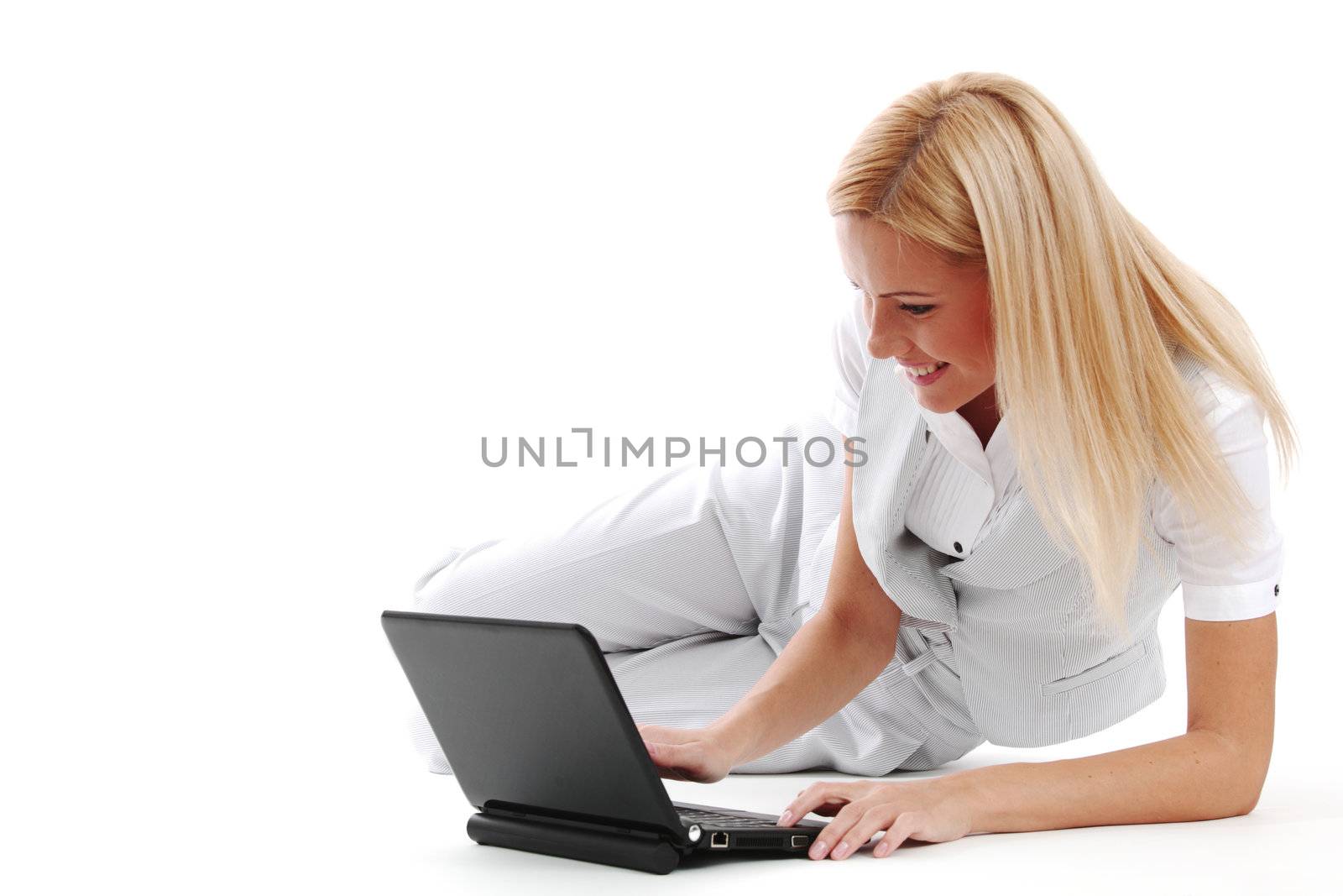business woman lies and working on laptop