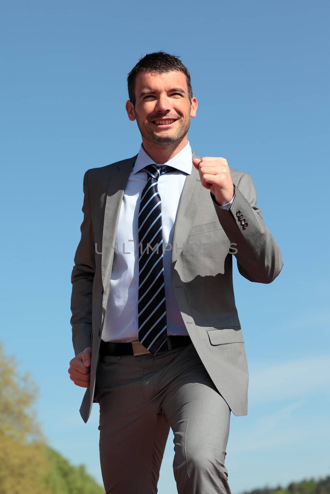 businessman runing outdoor in summer