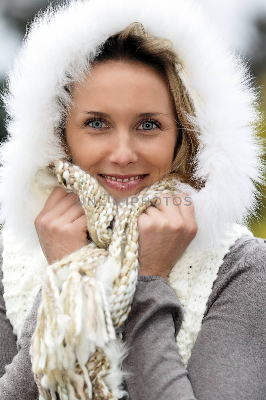 portrait of beautiful woman with blue eyes in autumn