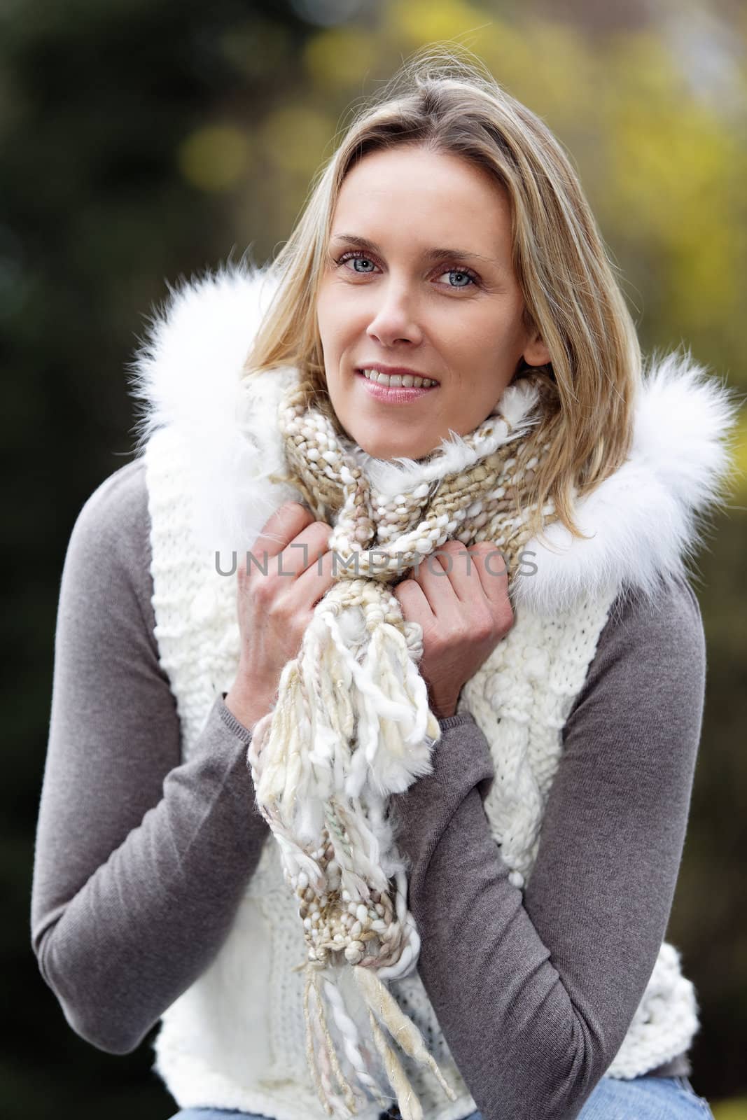 portrait of blond woman outdoor in autumn