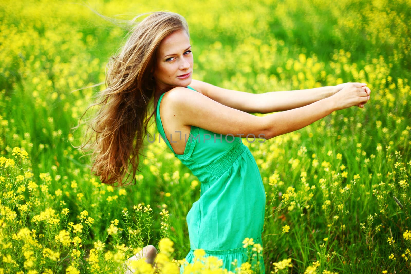 woman on oilseed field close portrait