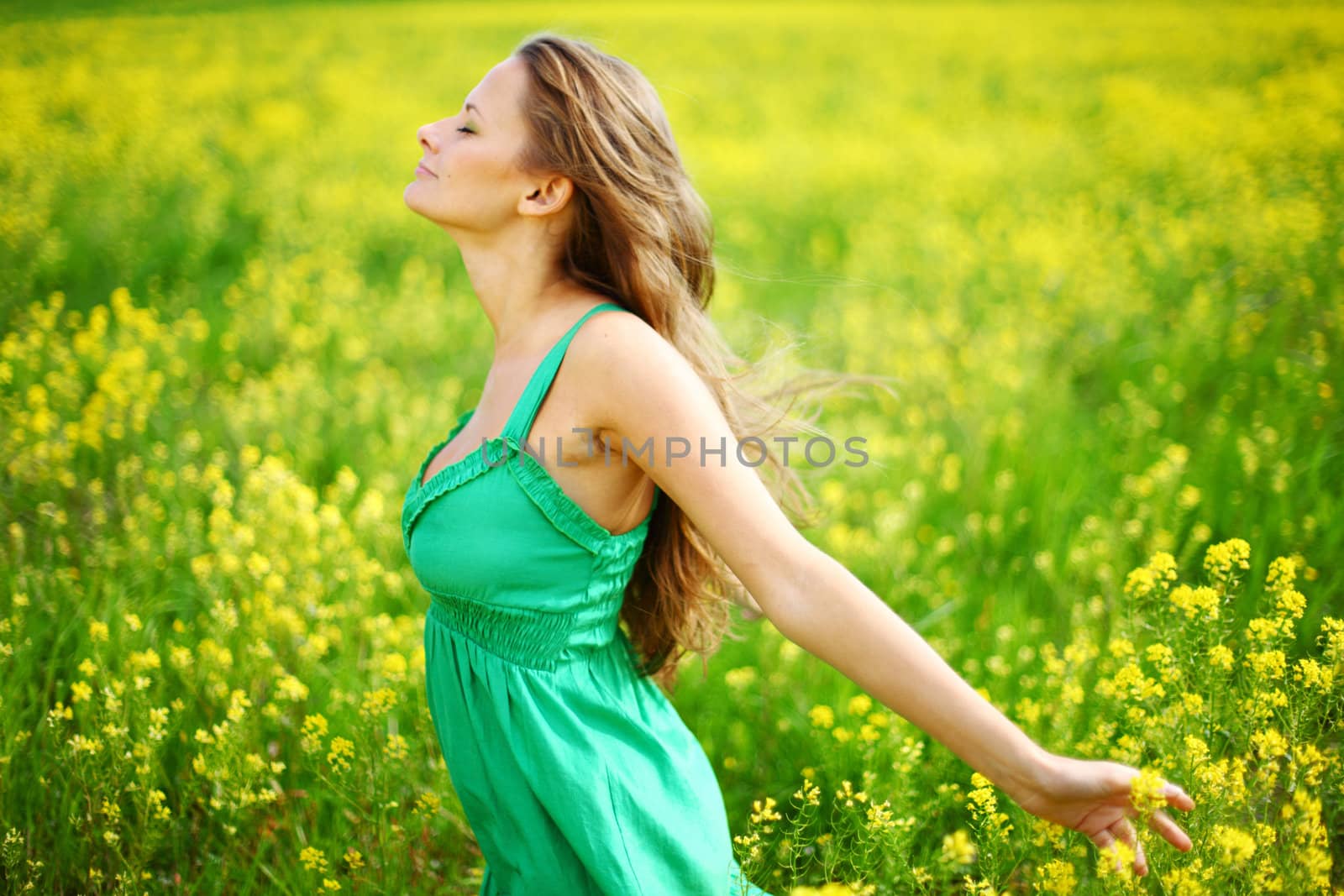 woman on oilseed field close portrait