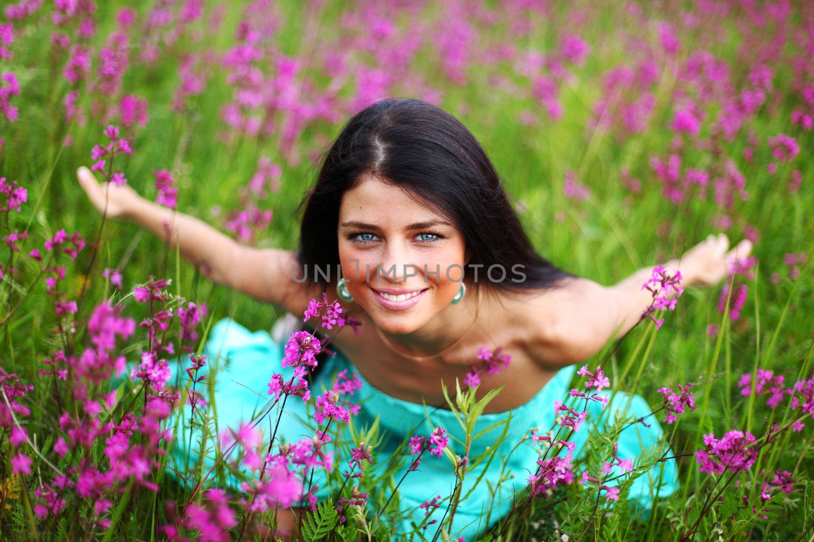  woman on pink flower field close portrait