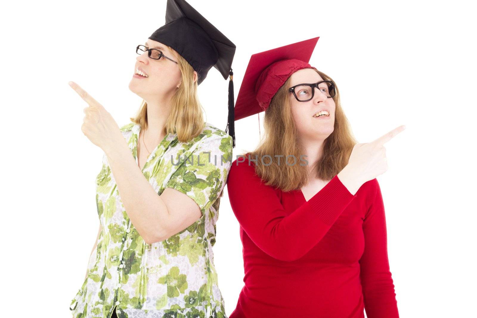 Two happy female graduates by gwolters