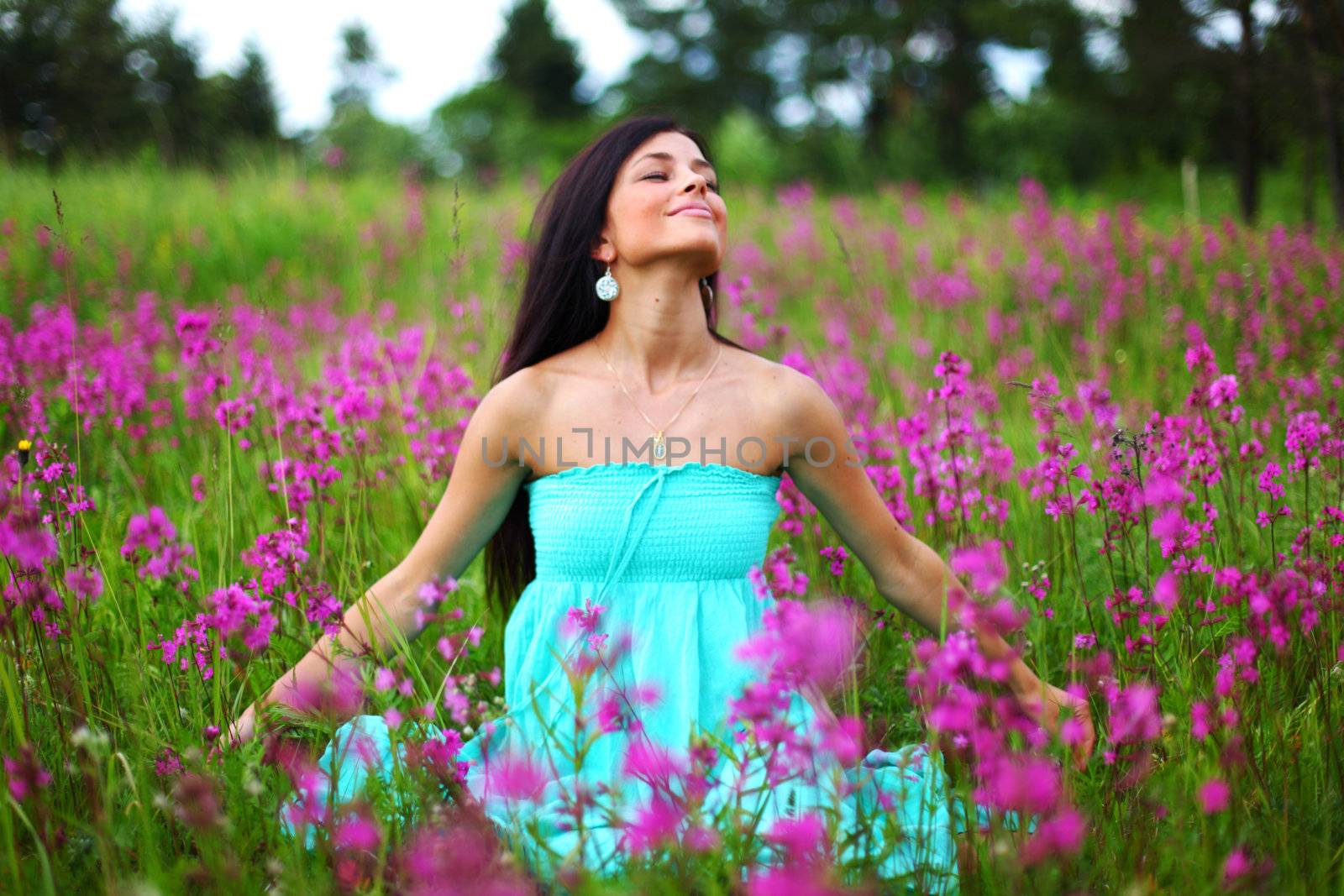  woman on pink flower field close portrait