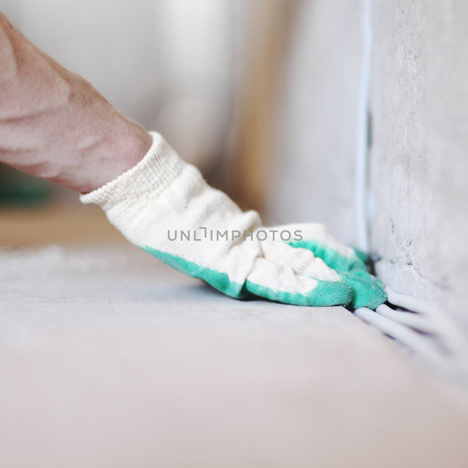 worker puts the wires in the wall