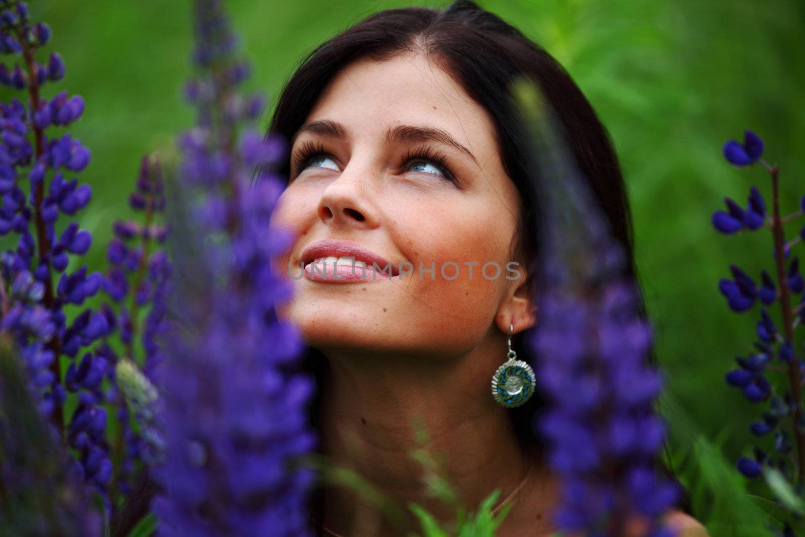 woman on pink flower field close portrait