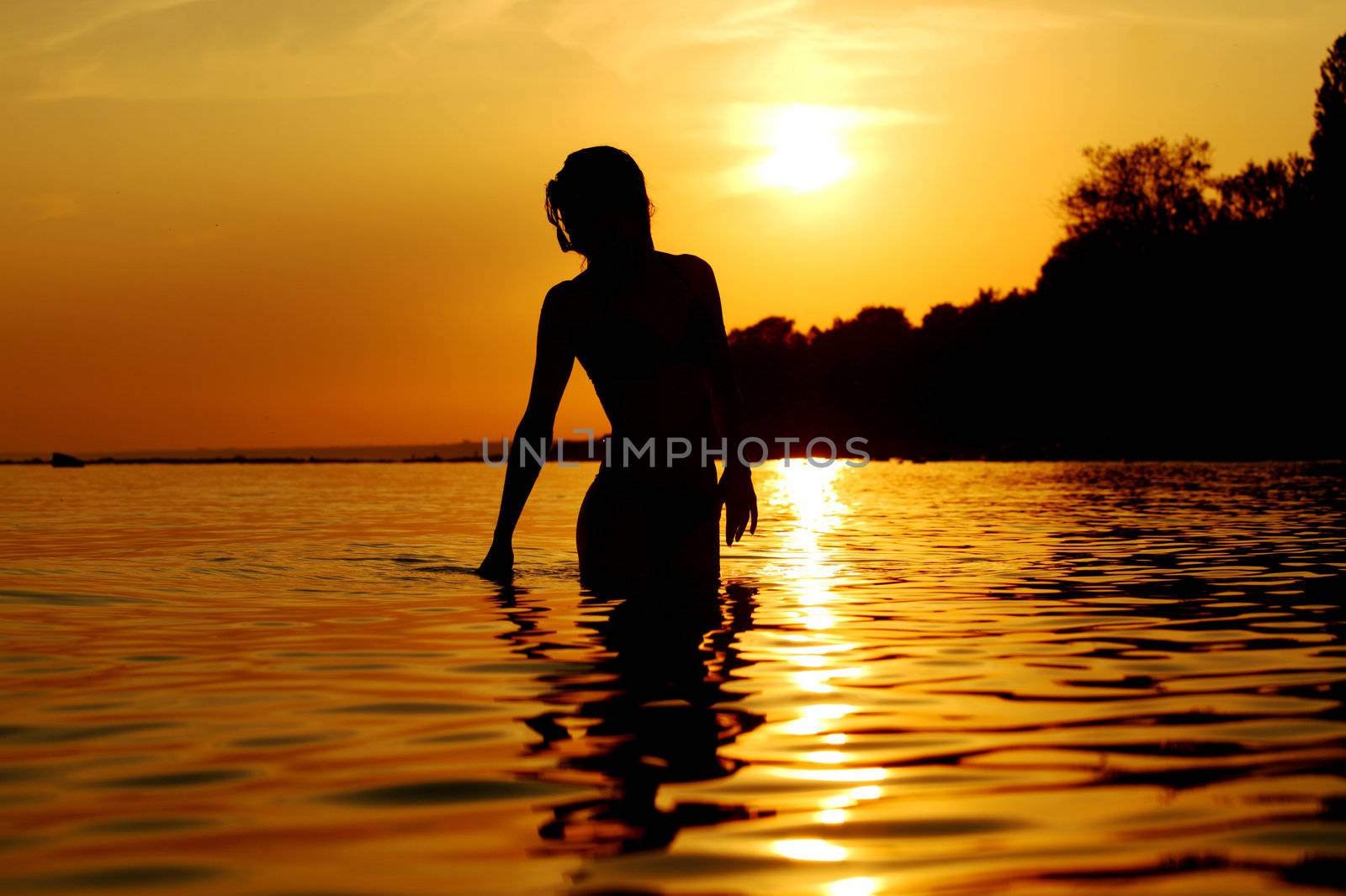 ocean woman in sunrise light