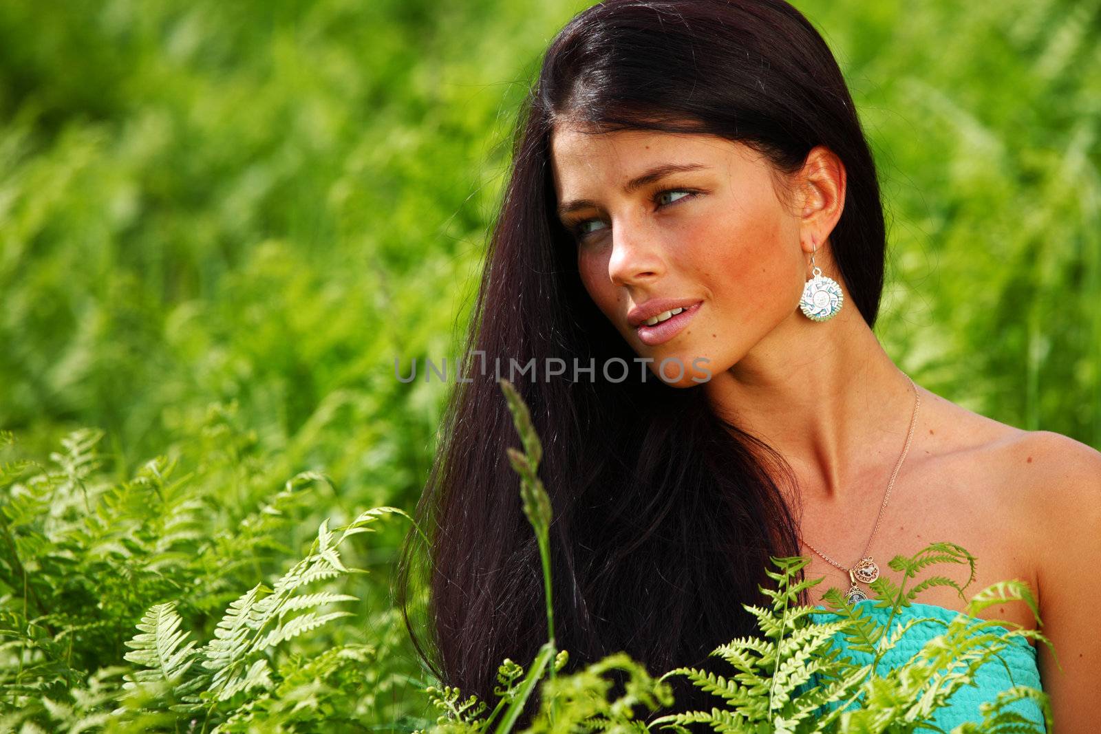 woman on flower field close portrait