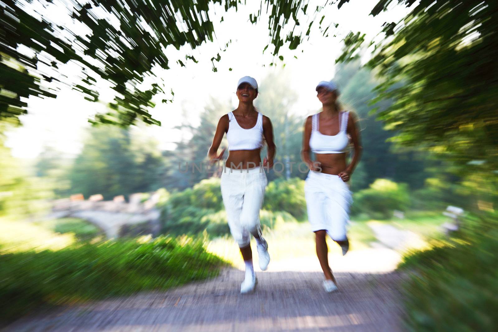 women run by sunny park alley