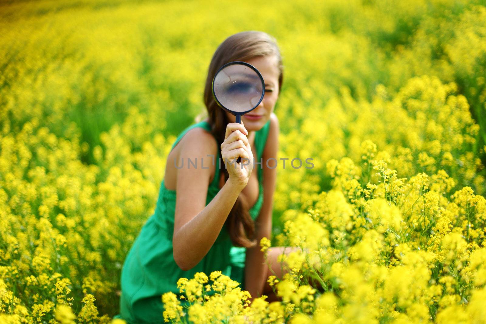 botanist woman in yellow flower field