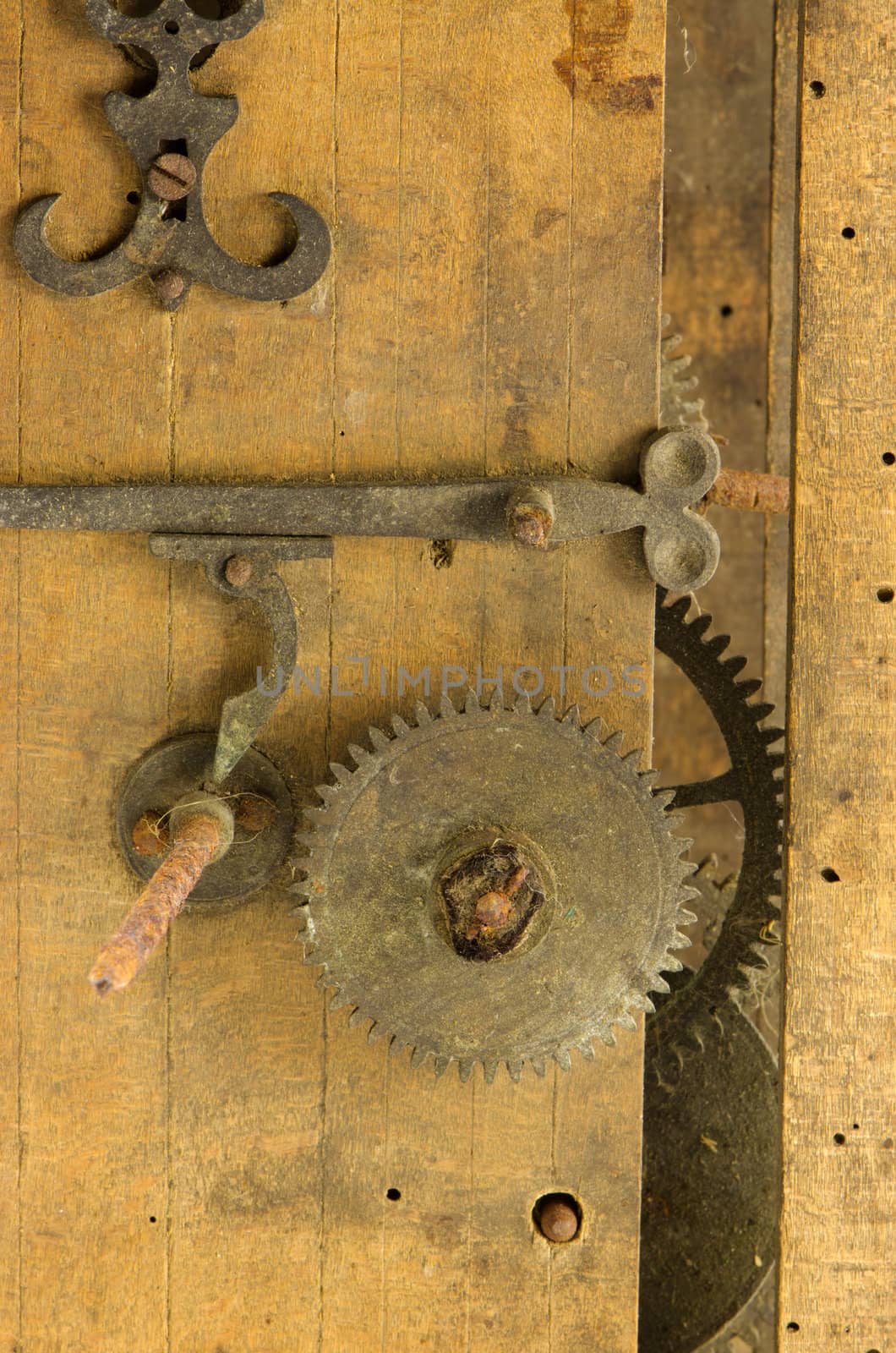 closeup retro wooden grunge clock box and mechanism gear wheel residue.