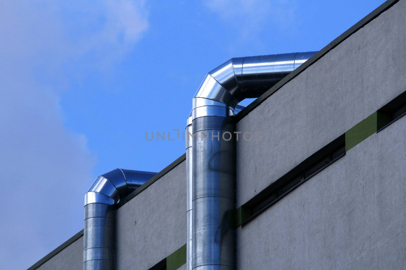 Metal round pipes of a heater in the house