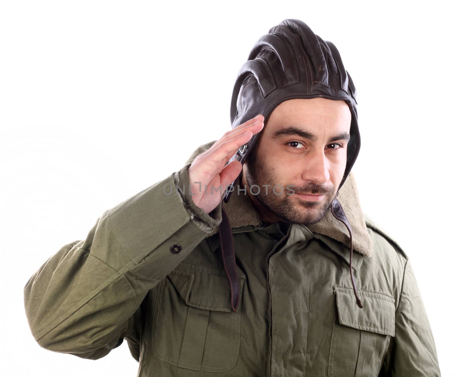 Portrait of a man saluting with a leather helmet over white 