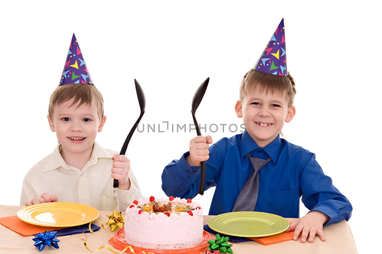 two happy boy with a cake isolated on white background