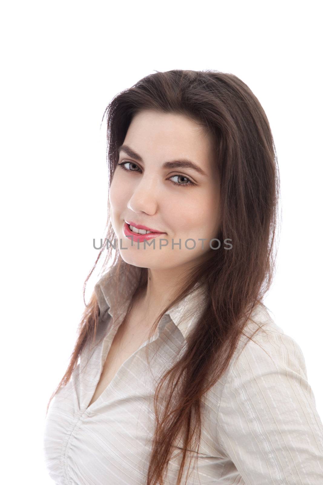 Closeup portrait of the head and shoulders of an attractive young brunette woman smiling at the camera isolated on white