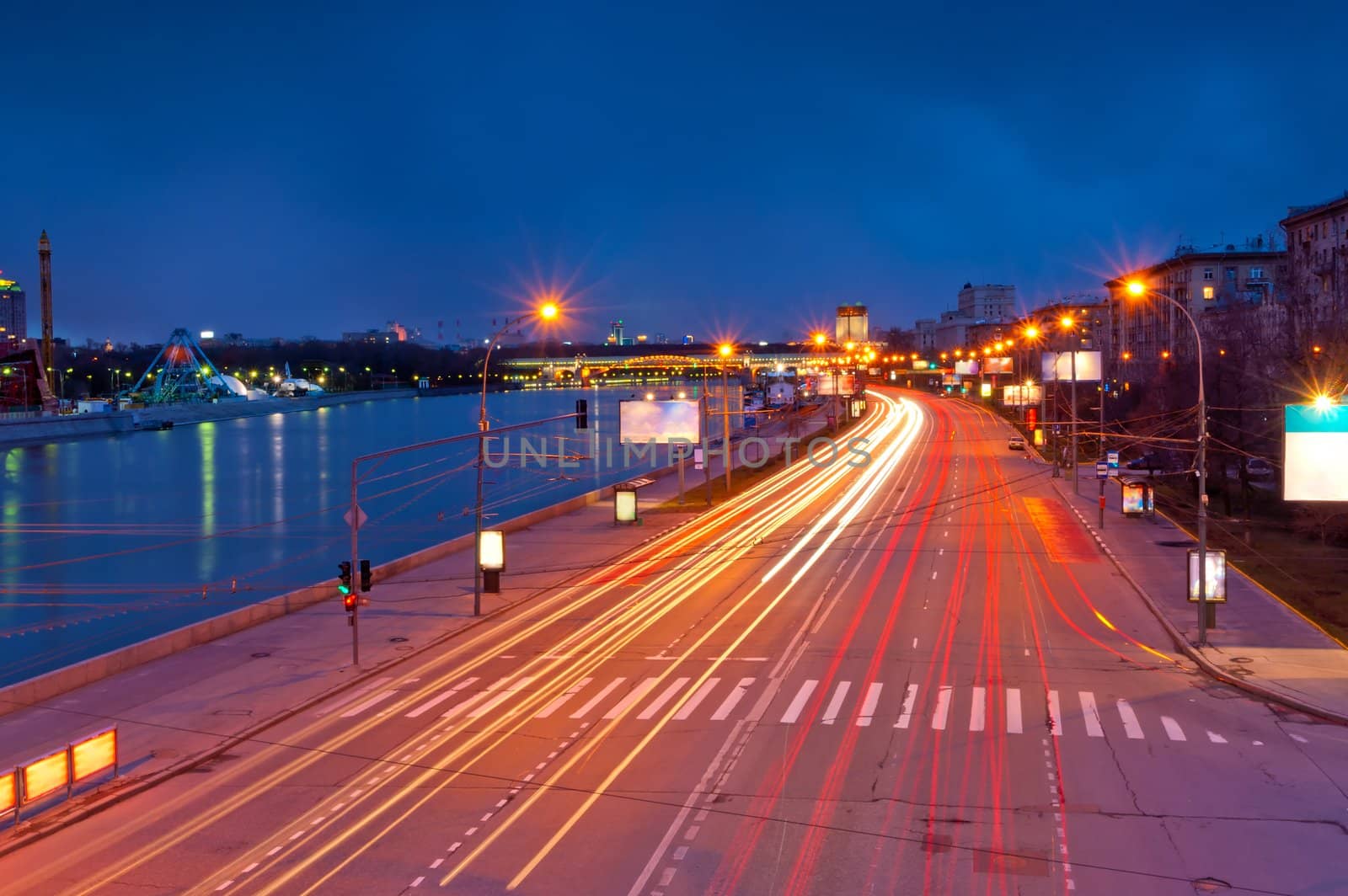 lights from the headlights in motion blur postural evening. Frundzenskaya embankment of the Moscow River. Moscow.