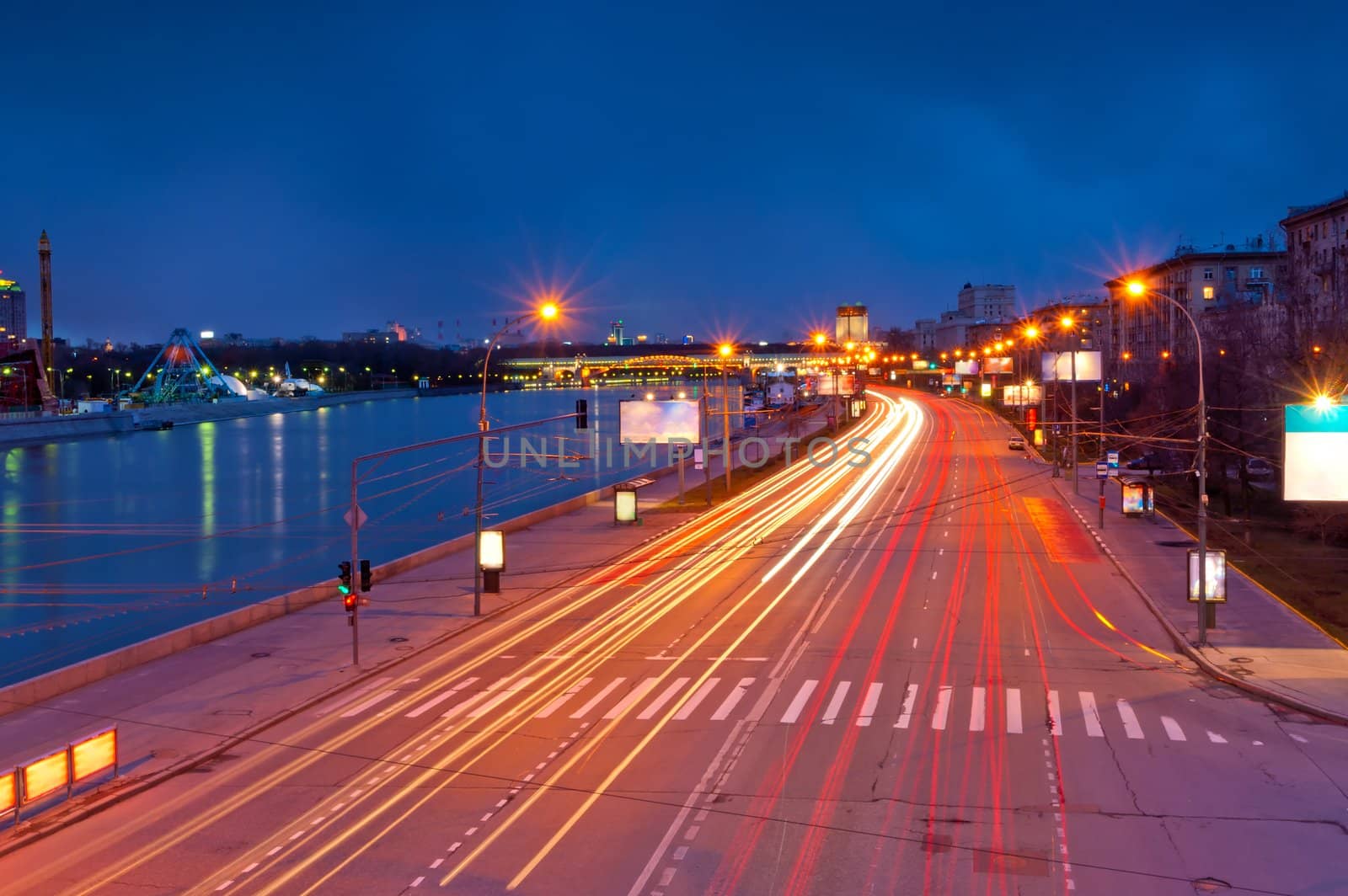 lights from the headlights in motion blur postural evening. Frundzenskaya embankment of the Moscow River. Moscow. by kosmsos111