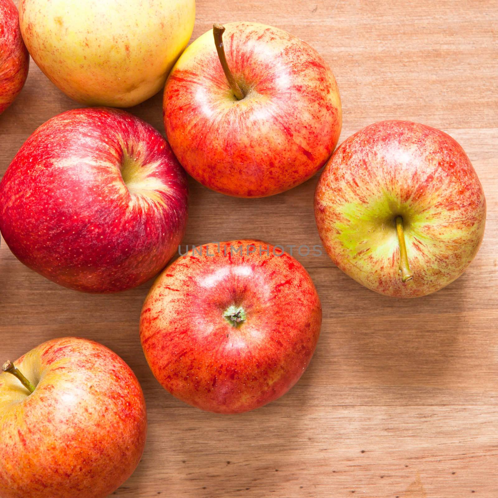 Freshly harvested apples on a wooden table