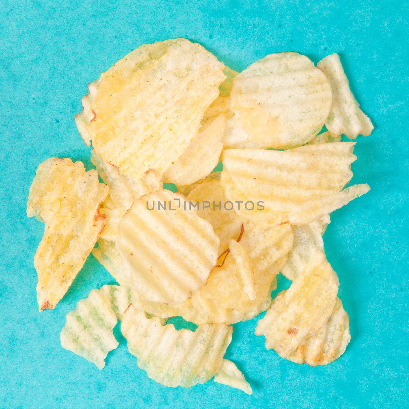 Crinkle cut potato chips on a vibrant background