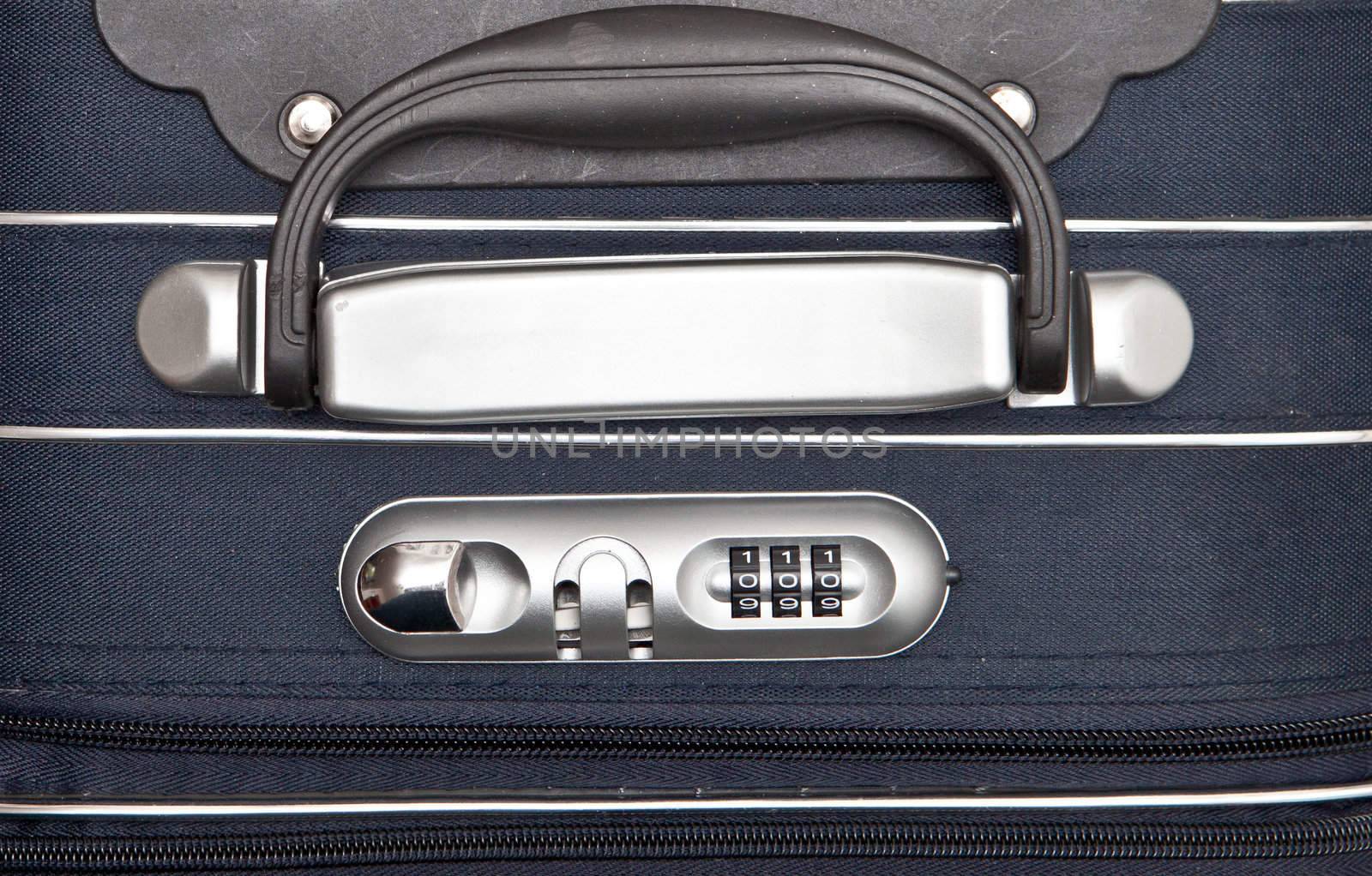 Handle of a modern suitcase with a combination lock