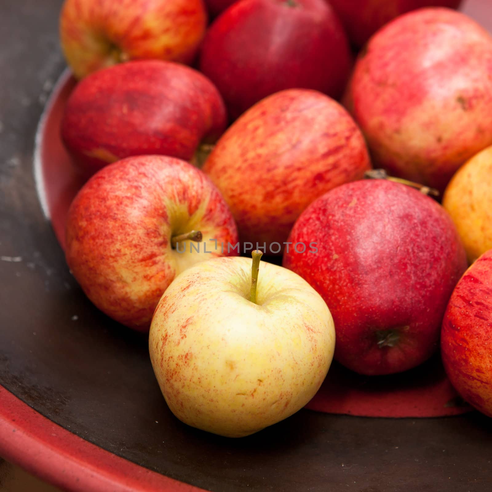 Selection of fresh apples in a fruit bowl