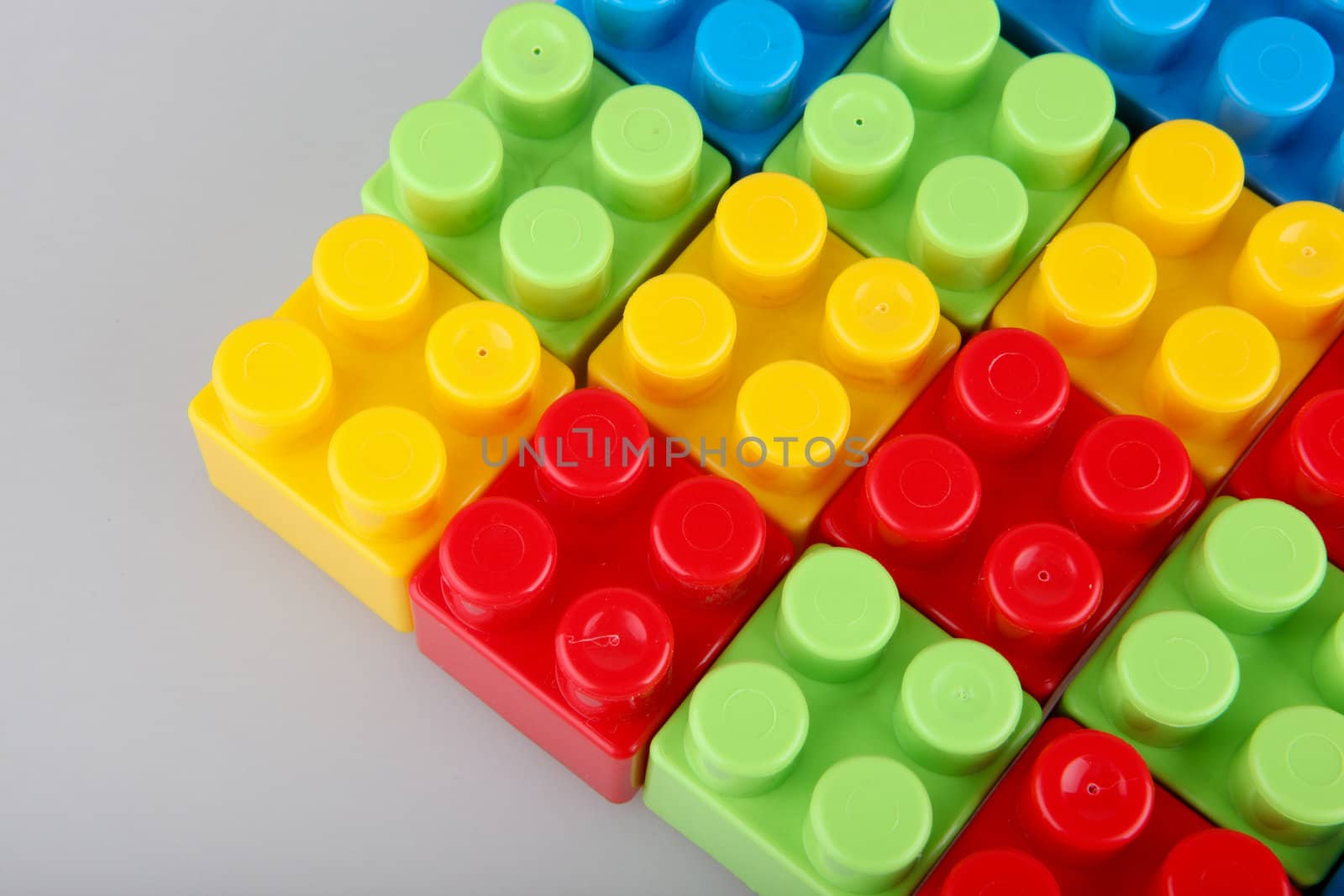 Plastic building blocks on a white background