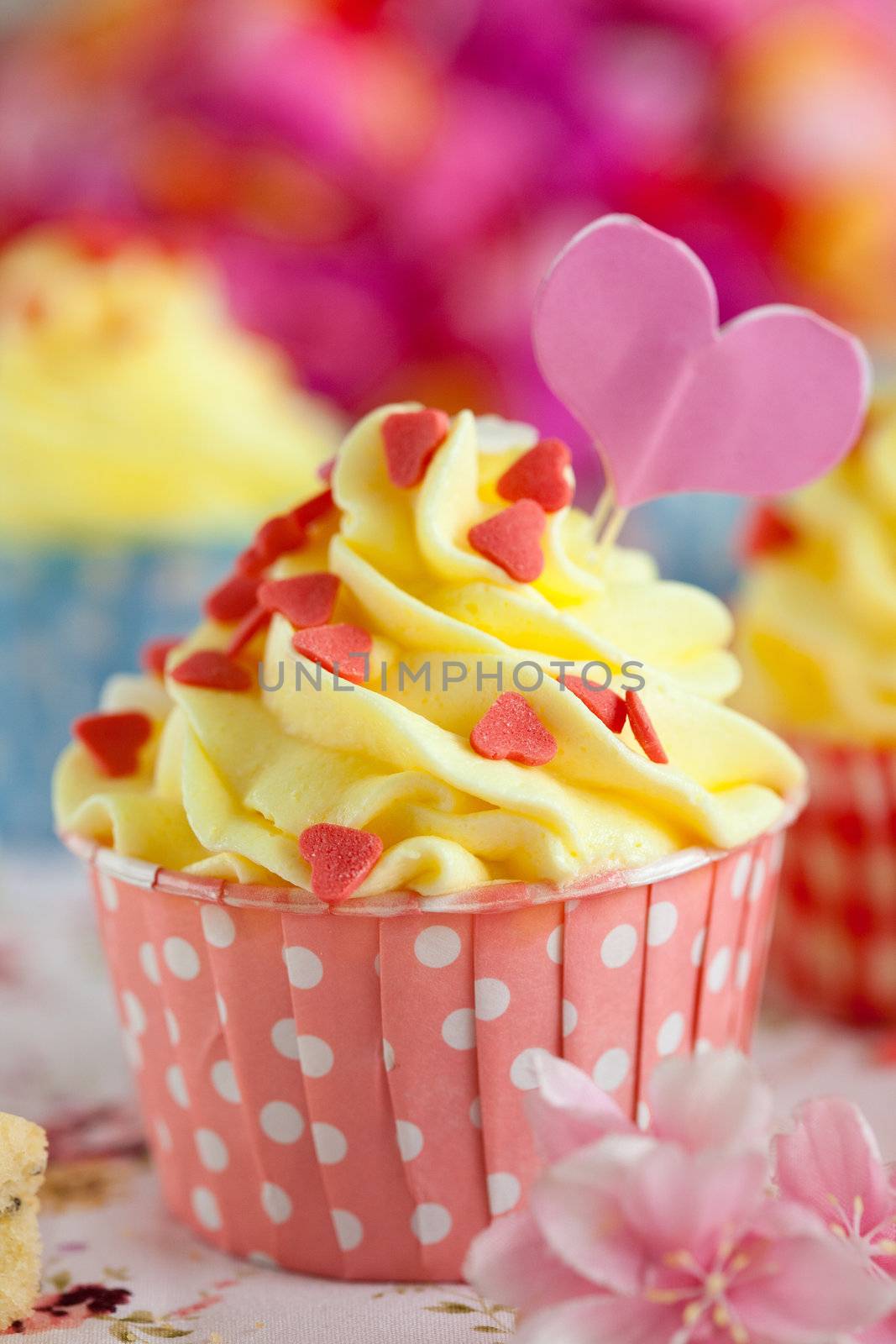 Cupcake with lemon buttercream dressed up for valentine
