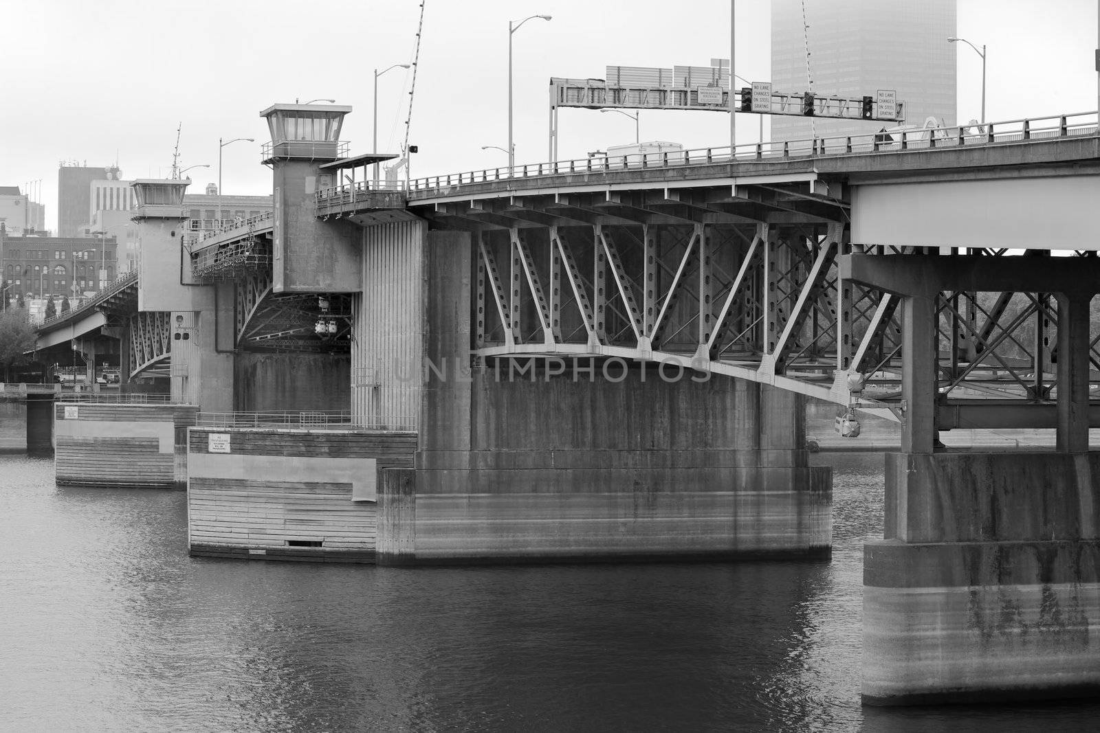 Portland's Burnside bridge over the Williamette River on a hazy day in black and white